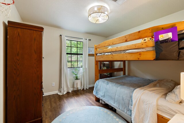 5623 Ridgeway Dr, Benton, AR 72019 - bedroom with wood finished floors and baseboards