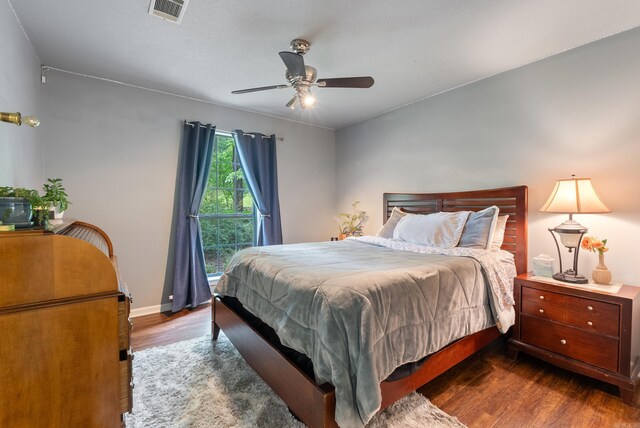 5623 Ridgeway Dr, Benton, AR 72019 - bedroom with wood finished floors, baseboards, and a ceiling fan