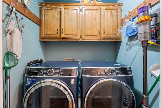 5623 Ridgeway Dr, Benton, AR 72019 - clothes washing area featuring washing machine and dryer and cabinet space