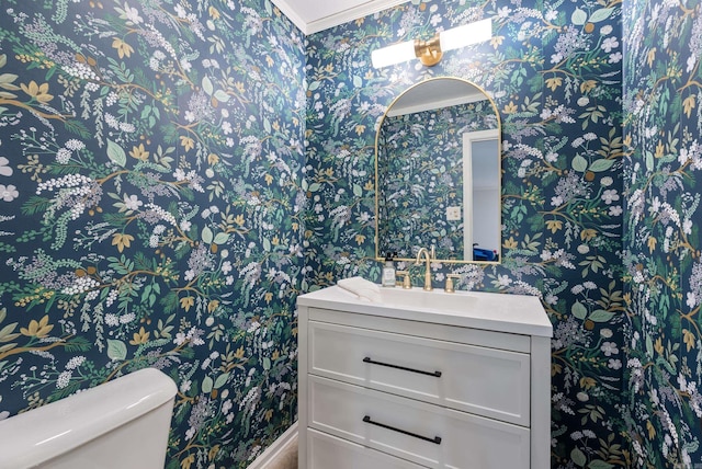 5623 Ridgeway Dr, Benton, AR 72019 - bathroom featuring wallpapered walls, toilet, vanity, and ornamental molding