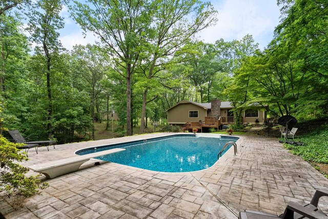 5623 Ridgeway Dr, Benton, AR 72019 - swimming pool with a wooden deck, a patio, and a diving board