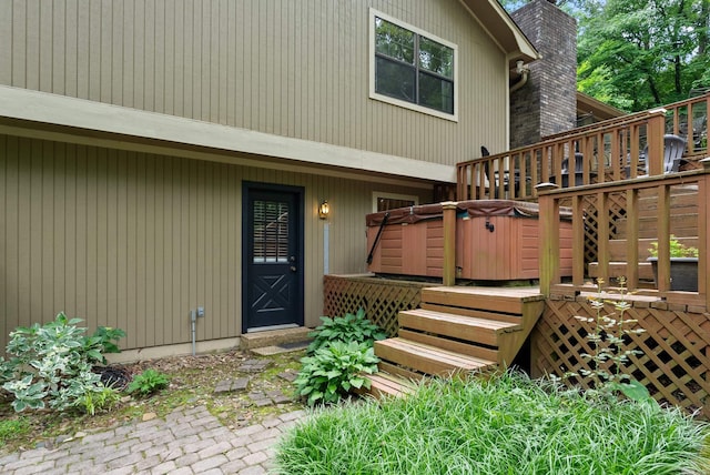 5623 Ridgeway Dr, Benton, AR 72019 - view of exterior entry with a chimney and a deck