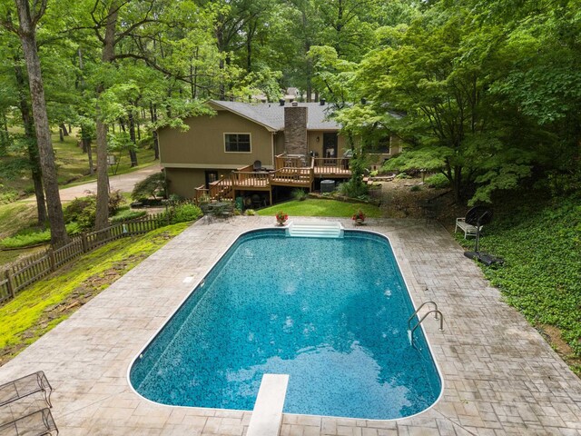 5623 Ridgeway Dr, Benton, AR 72019 - view of pool featuring a wooden deck, fence, a diving board, and a patio