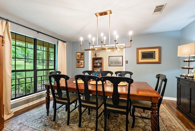 5623 Ridgeway Dr, Benton, AR 72019 - dining space with dark wood-style floors, baseboards, and a chandelier
