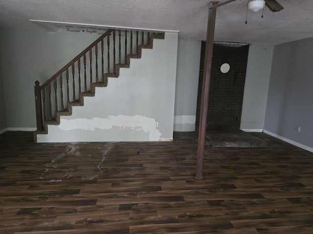 171 Riverbend Rd, Mammoth Spring, AR 72554 - stairway with a textured ceiling, wood finished floors, baseboards, and ceiling fan