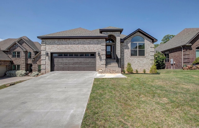 121 Majestic Cir, Maumelle, AR 72113 - view of front of property with an attached garage, brick siding, driveway, and a front lawn