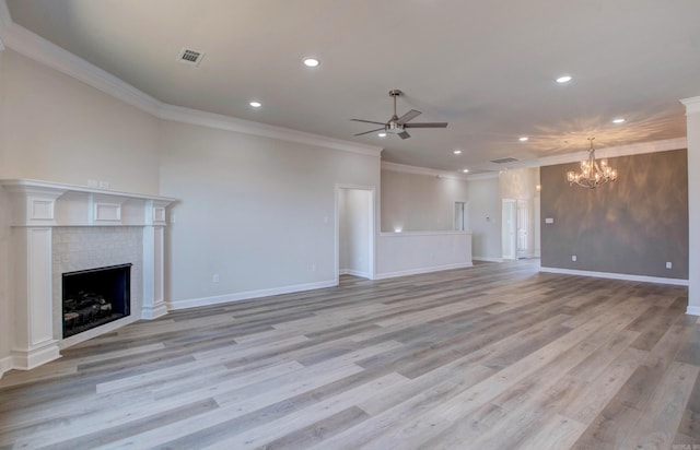 121 Majestic Cir, Maumelle, AR 72113 - unfurnished living room with ceiling fan, recessed lighting, a tile fireplace, crown molding, and a chandelier