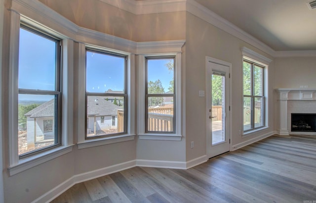 121 Majestic Cir, Maumelle, AR 72113 - interior space featuring wood finished floors, baseboards, ornamental molding, and a fireplace with flush hearth