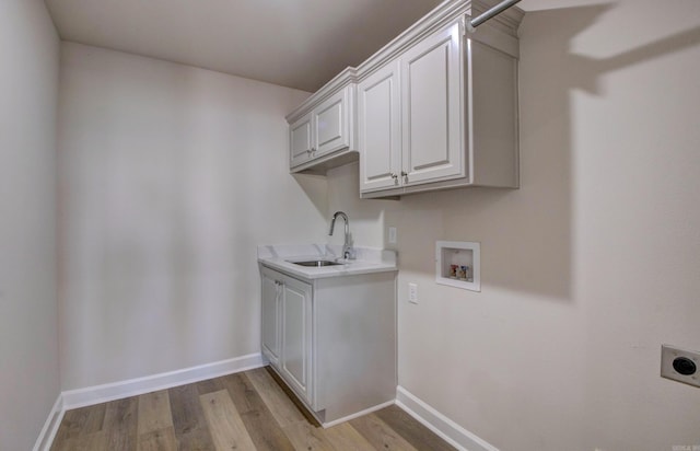 121 Majestic Cir, Maumelle, AR 72113 - laundry area with electric dryer hookup, cabinet space, washer hookup, light wood-style floors, and baseboards