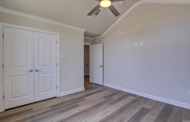 121 Majestic Cir, Maumelle, AR 72113 - unfurnished bedroom featuring lofted ceiling, wood finished floors, baseboards, a closet, and a ceiling fan