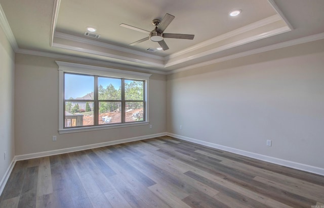 121 Majestic Cir, Maumelle, AR 72113 - empty room featuring a raised ceiling, a ceiling fan, crown molding, wood finished floors, and baseboards