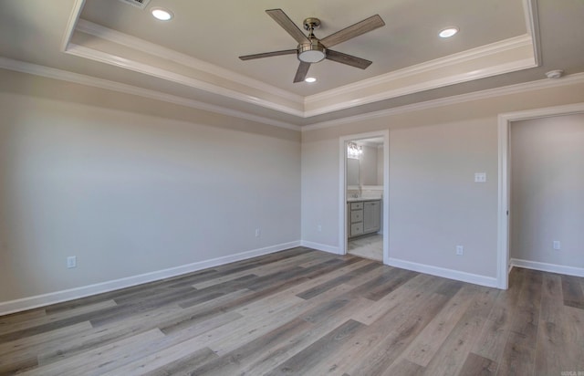 121 Majestic Cir, Maumelle, AR 72113 - empty room with a raised ceiling, ceiling fan, ornamental molding, light wood finished floors, and baseboards