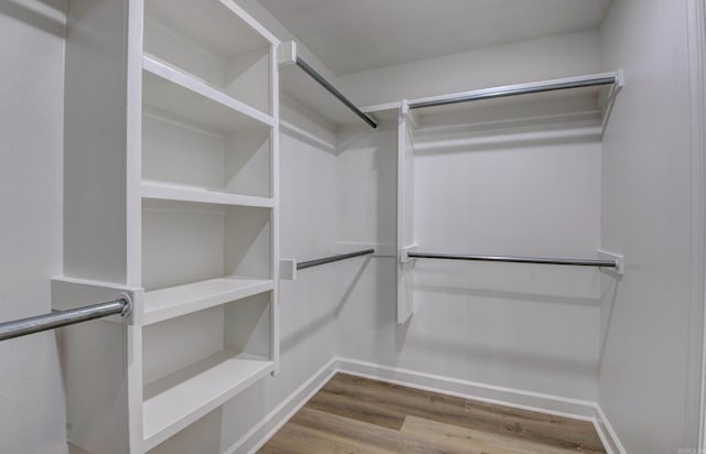 121 Majestic Cir, Maumelle, AR 72113 - spacious closet featuring wood finished floors