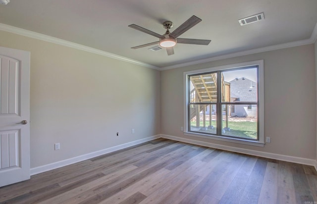121 Majestic Cir, Maumelle, AR 72113 - empty room with wood finished floors, baseboards, ornamental molding, and ceiling fan