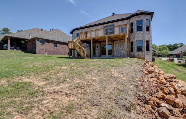 121 Majestic Cir, Maumelle, AR 72113 - rear view of house with brick siding, stairs, a deck, and a yard