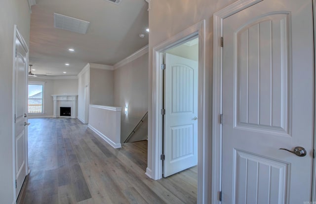 121 Majestic Cir, Maumelle, AR 72113 - hallway featuring ornamental molding, wood finished floors, baseboards, recessed lighting, and an upstairs landing