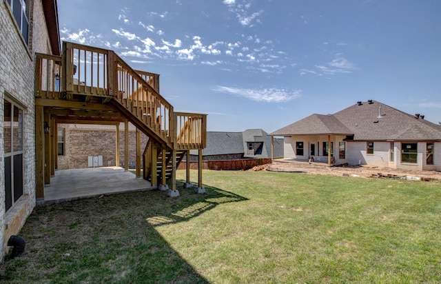 121 Majestic Cir, Maumelle, AR 72113 - view of green lawn featuring a patio area, stairway, and a wooden deck