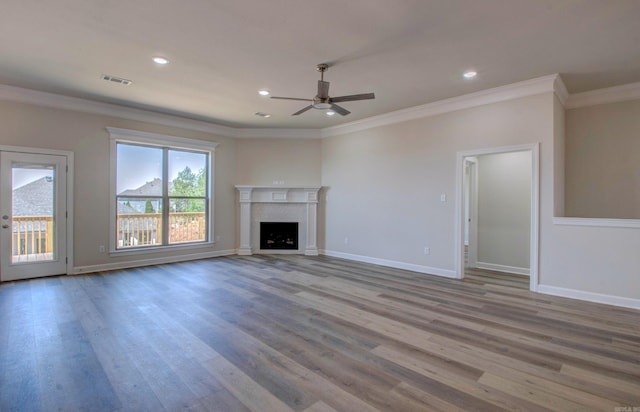 121 Majestic Cir, Maumelle, AR 72113 - unfurnished living room with a ceiling fan, crown molding, wood finished floors, baseboards, and recessed lighting