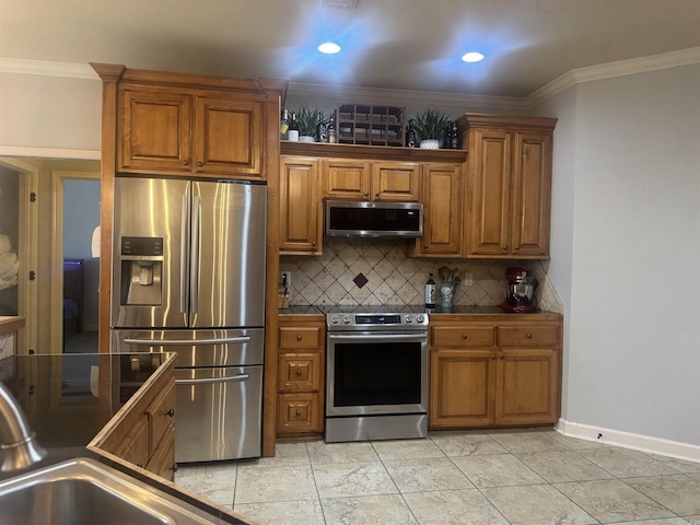 kitchen featuring stainless steel appliances, brown cabinets, tasteful backsplash, ornamental molding, and recessed lighting