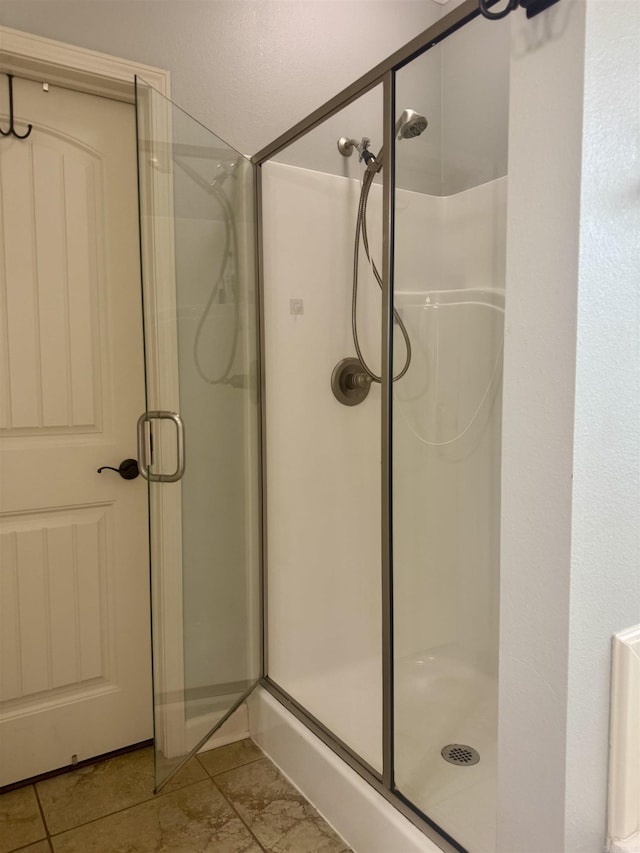 bathroom featuring a shower stall