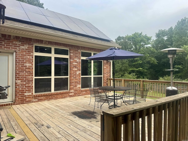 wooden deck with outdoor dining space