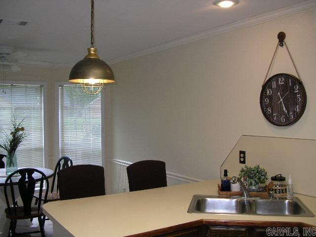 11 Sharondale Ct, Maumelle, AR 72113 - dining area with crown molding and ceiling fan