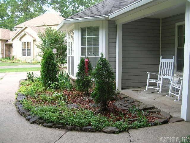 11 Sharondale Ct, Maumelle, AR 72113 - view of side of property featuring roof with shingles