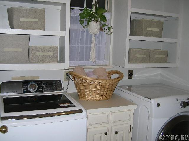 11 Sharondale Ct, Maumelle, AR 72113 - laundry area featuring cabinet space and washer and dryer