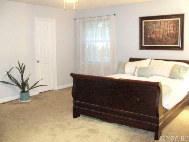11 Sharondale Ct, Maumelle, AR 72113 - carpeted bedroom featuring baseboards