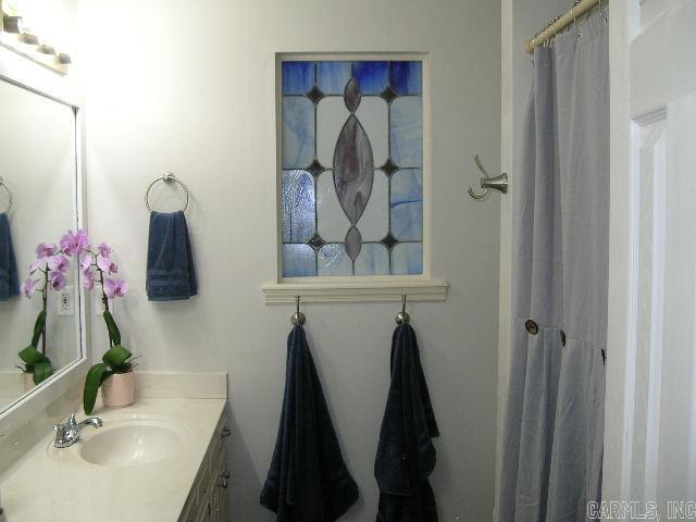 11 Sharondale Ct, Maumelle, AR 72113 - bathroom featuring vanity
