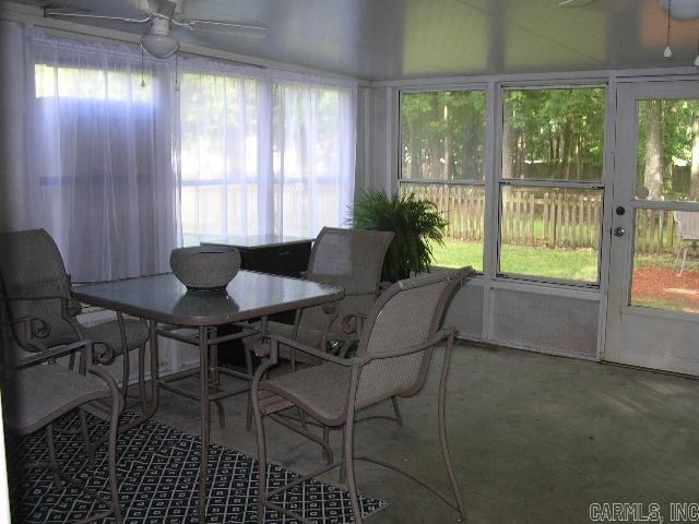 11 Sharondale Ct, Maumelle, AR 72113 - sunroom featuring a ceiling fan and outdoor dining space