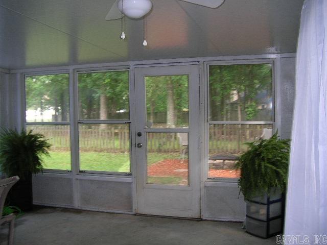 11 Sharondale Ct, Maumelle, AR 72113 - unfurnished sunroom with a ceiling fan and healthy amount of natural light