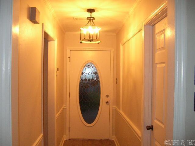 11 Sharondale Ct, Maumelle, AR 72113 - doorway with crown molding