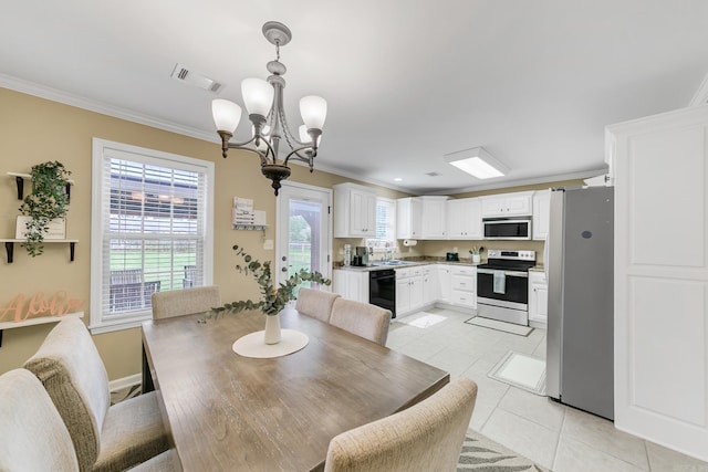 41 Winners Cir, Cabot, AR 72023 - dining area with crown molding, a chandelier, light tile patterned floors, and baseboards