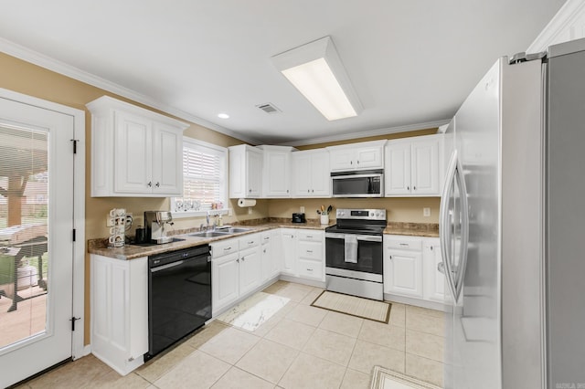 41 Winners Cir, Cabot, AR 72023 - kitchen featuring appliances with stainless steel finishes, light tile patterned flooring, a sink, ornamental molding, and white cabinets