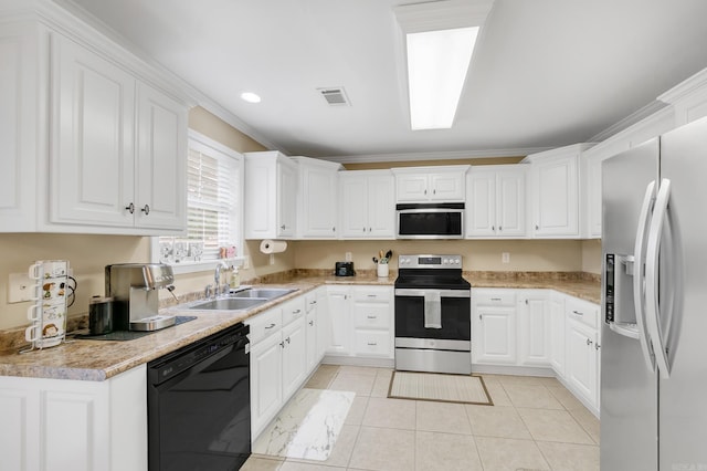 41 Winners Cir, Cabot, AR 72023 - kitchen featuring stainless steel appliances, a sink, light tile patterned flooring, white cabinets, and light countertops