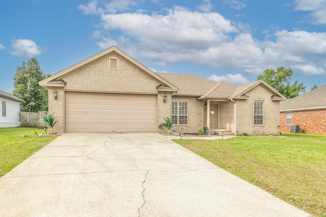 41 Winners Cir, Cabot, AR 72023 - single story home featuring central air condition unit, concrete driveway, brick siding, an attached garage, and roof with shingles