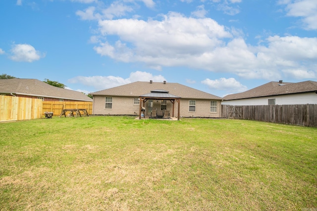 41 Winners Cir, Cabot, AR 72023 - rear view of property featuring a gazebo, brick siding, and a patio area