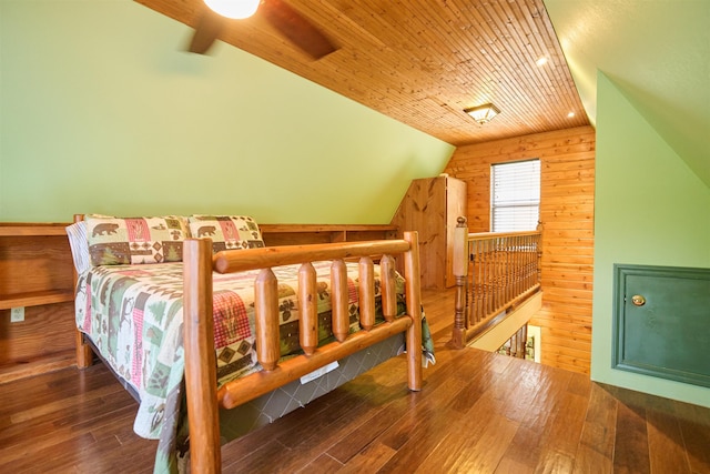 1 Kiwanie Crk, Cherokee Village, AR 72542 - bedroom featuring lofted ceiling, wood walls, and hardwood / wood-style floors