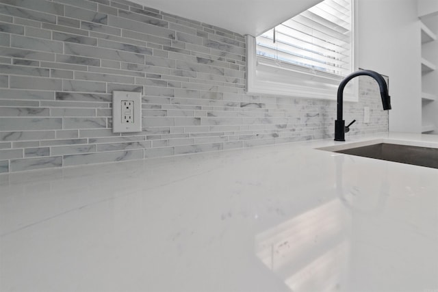 3113 W 11th, Little Rock, AR 72204 - kitchen view of backsplash, a sink, and light countertops