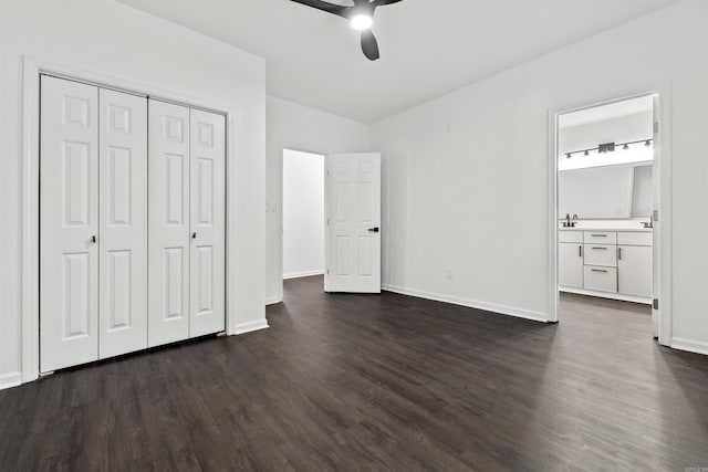 3113 W 11th, Little Rock, AR 72204 - unfurnished bedroom with dark wood-type flooring, baseboards, a closet, ensuite bathroom, and ceiling fan