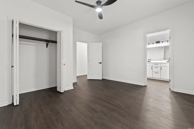 3113 W 11th, Little Rock, AR 72204 - unfurnished bedroom with dark wood-style flooring, a closet, baseboards, ceiling fan, and connected bathroom