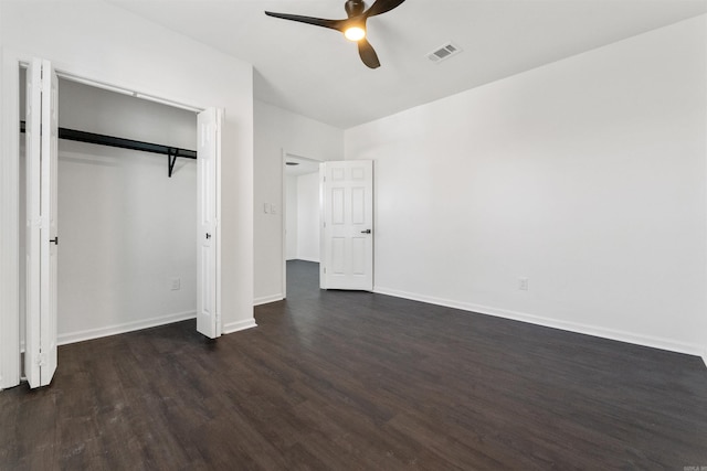3113 W 11th, Little Rock, AR 72204 - unfurnished bedroom with dark wood-style floors, baseboards, a ceiling fan, and a closet