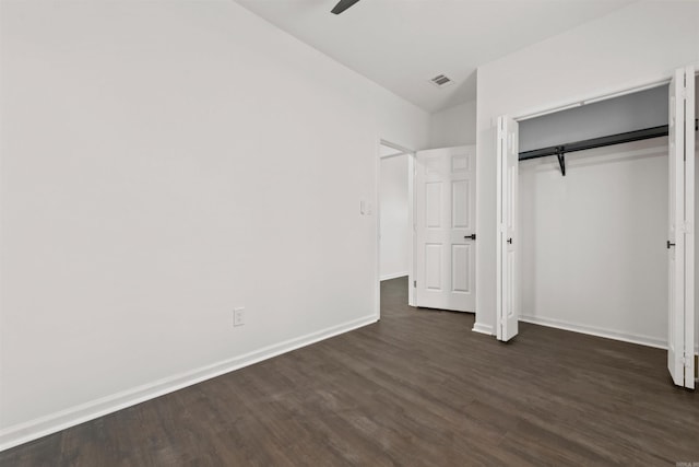 3113 W 11th, Little Rock, AR 72204 - unfurnished bedroom featuring dark wood finished floors, baseboards, a closet, and ceiling fan