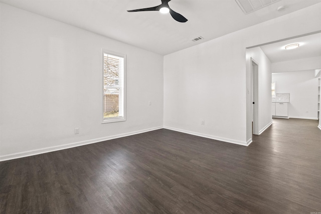 3113 W 11th, Little Rock, AR 72204 - spare room featuring ceiling fan, dark wood finished floors, and baseboards