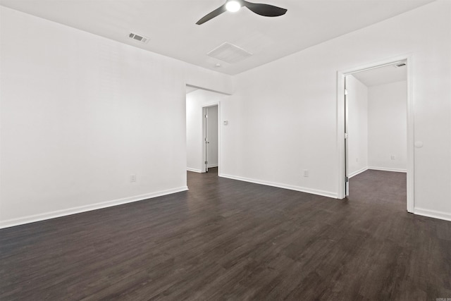 3113 W 11th, Little Rock, AR 72204 - unfurnished room with dark wood-style flooring, a ceiling fan, and baseboards