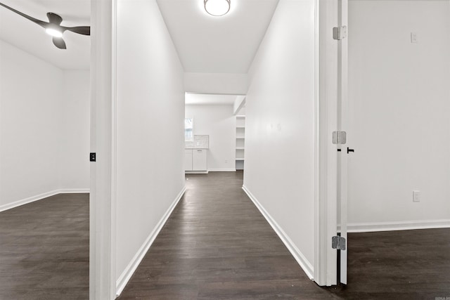 3113 W 11th, Little Rock, AR 72204 - hallway featuring dark wood-type flooring and baseboards