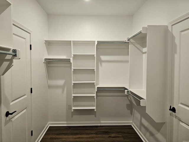 252 Kelton St, Hensley, AR 72065 - spacious closet with dark wood-style floors