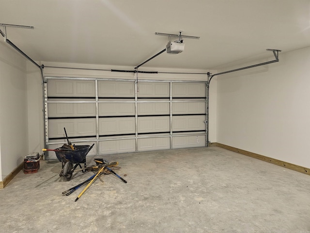 252 Kelton St, Hensley, AR 72065 - garage featuring a garage door opener and baseboards
