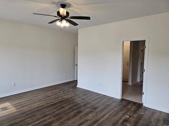252 Kelton St, Hensley, AR 72065 - spare room with dark wood-style floors, a ceiling fan, and baseboards
